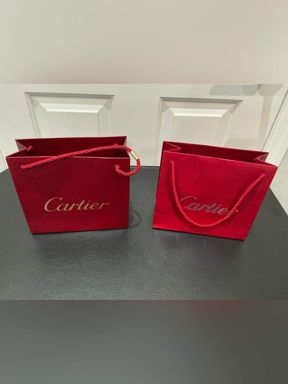 Cartier red paper shopping gift bag set of two. 8” x 7” x 3”